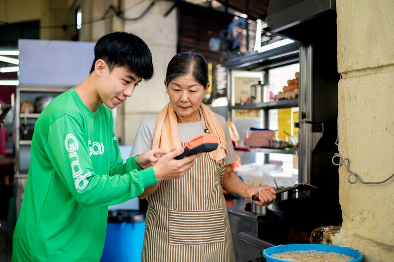 A son and mother working together in a family business.