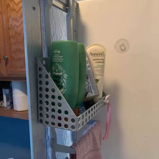 A shower caddy hanging on a wall
