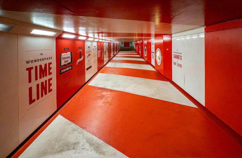 An underground corridor with "Time Line" written on the wall.