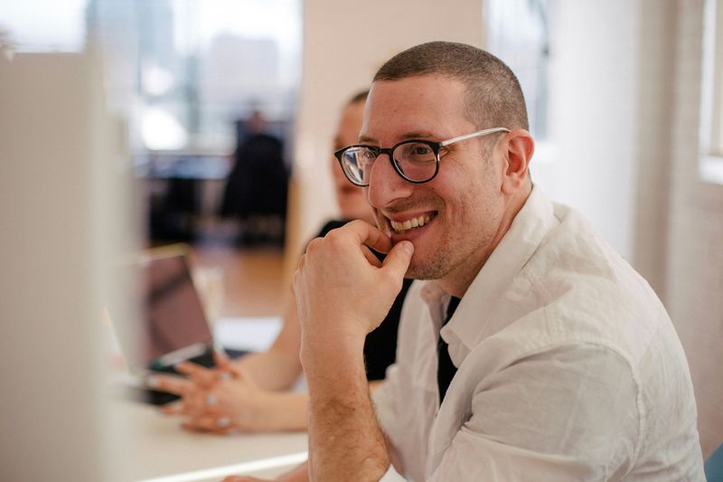 A man looking happy in his job.