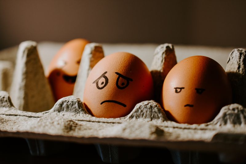 Photo of eggs with emotions drawn on them.