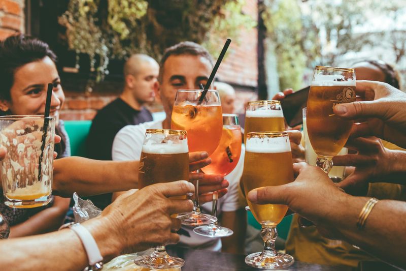 A group of people drinking in a pub.