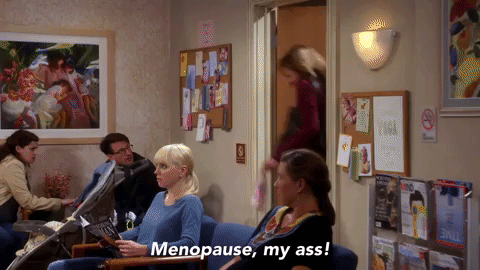 A woman running through a doctor's office shouting, 'Menopause, my ass!'