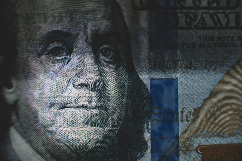 A grim-looking face on a dollar bill.