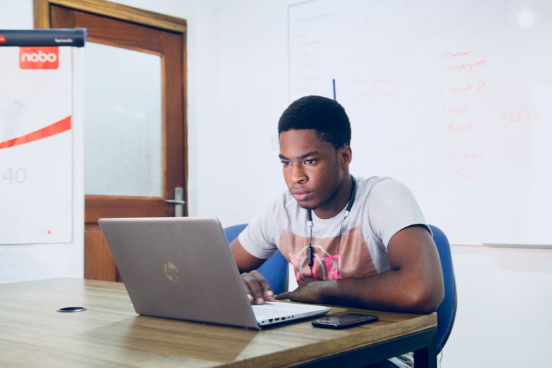 Teen working on laptop