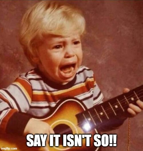 crying child holding a guitar. text says say it isn't so.