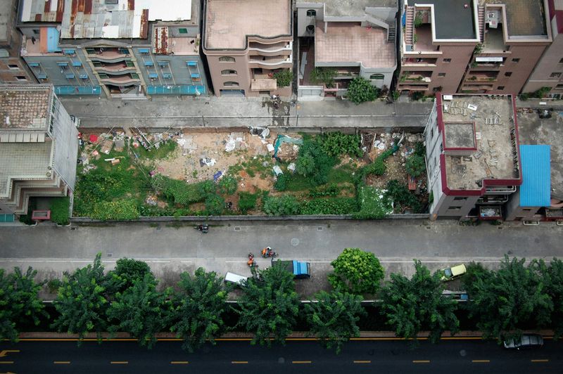 Arial view of a community garden and green streetscape in a city.