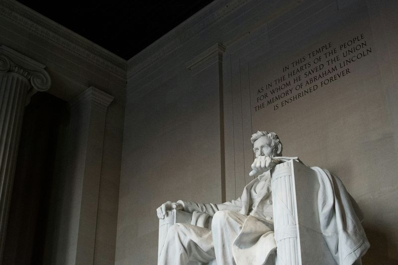 Abraham Lincoln's marble statue in Washington, DC, representing metamorphic rock in the rock cycle diagram.