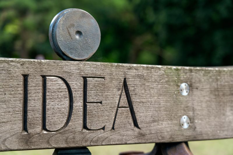 A wooden panel with 'idea' engraved onto it.