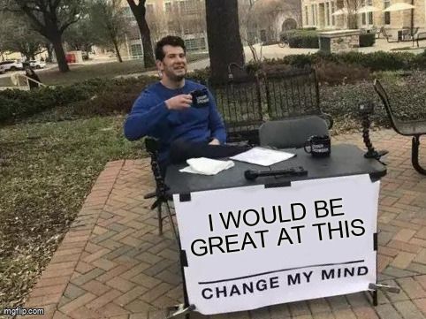 A man at a table with sign that says, 'I would be great at this, change my mind.'