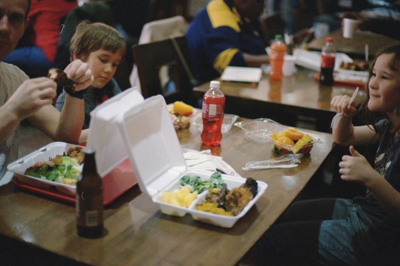 Children being looked after in a school cafeteria.