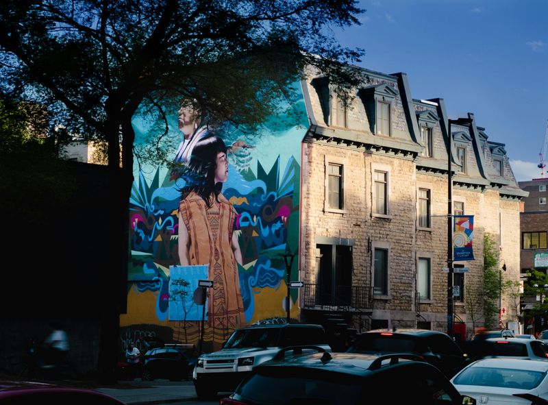 A mural celebrating Indigenous history on a street in Montreal.