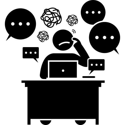 Icon: Person frowning, sitting at a desk with computer, scribbles above their head and many speech bubbles around them
