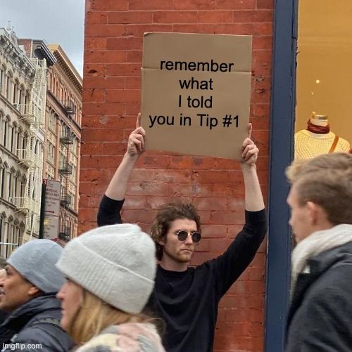 The same man from Tip #1 holding the same sign, but the text reads, 'Remember what I told you in Tip #1.'