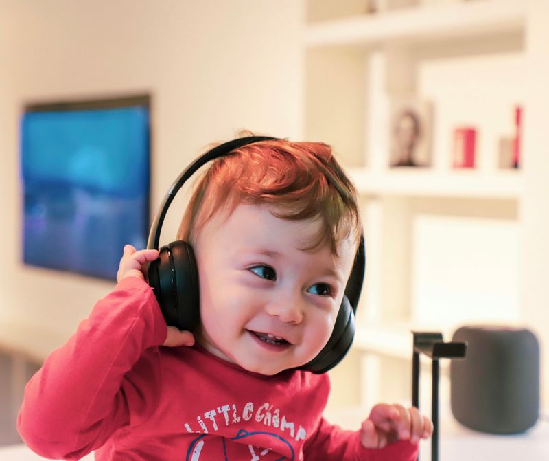 A young boy with headphones on.
