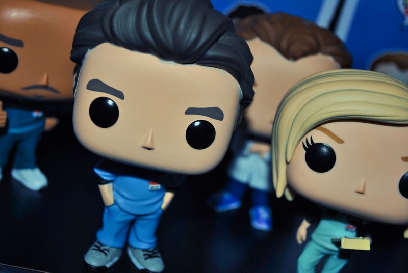 Multicultural funko pops standing in medical scrubs