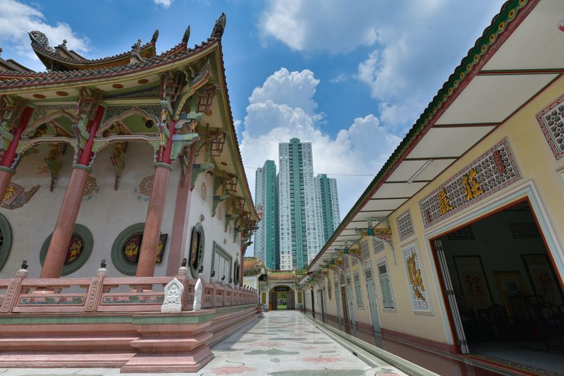 Chinese temple with skyscrapers in the background