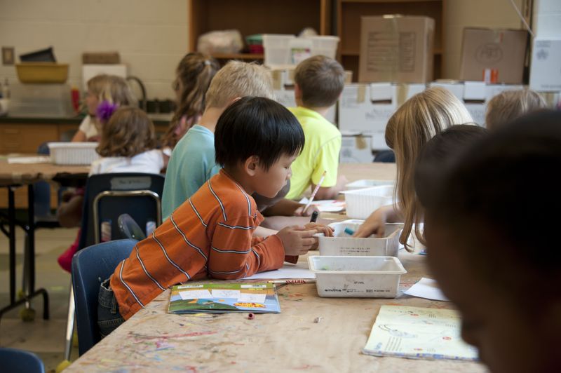 Children in a classroom doing arts and crafts