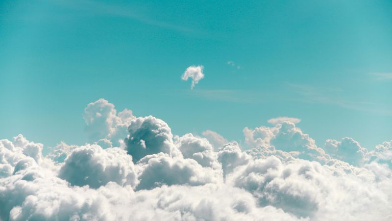 Large, fluffy clouds in a light blue sky. 