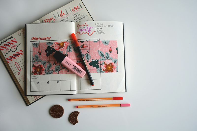 A journal with an open calendar page.