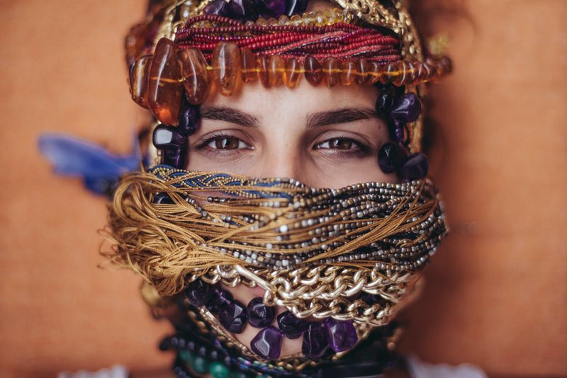 A woman wearing traditional face beads