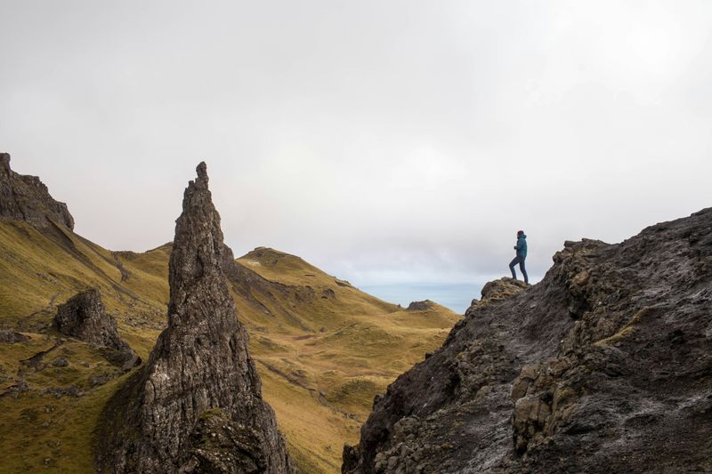 A person on the top of a mountain. 