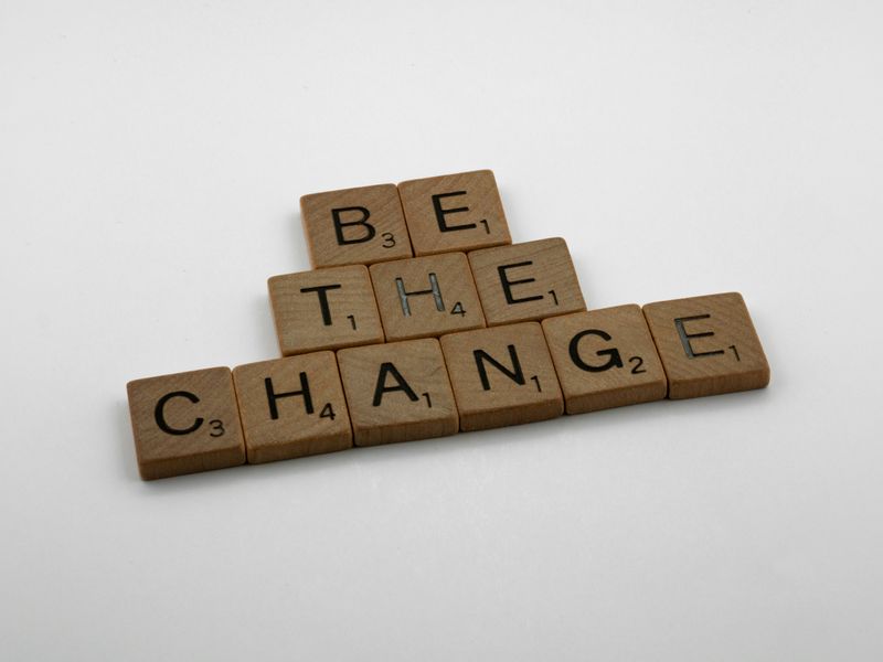 Scrabble letters that spell out, 'be the change'.