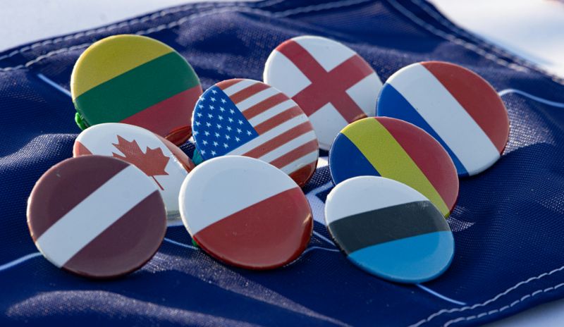 Pictures of badges displaying different country flags.