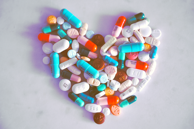 colourful pills in the shape of a heart