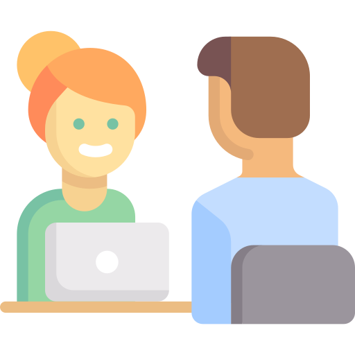 Icon image of a woman sitting down at a table with her laptop talking with a person on the other side of the table. 