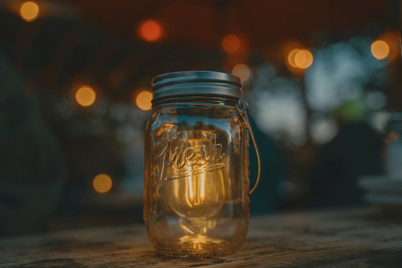 A jar with a lightbulb in it.