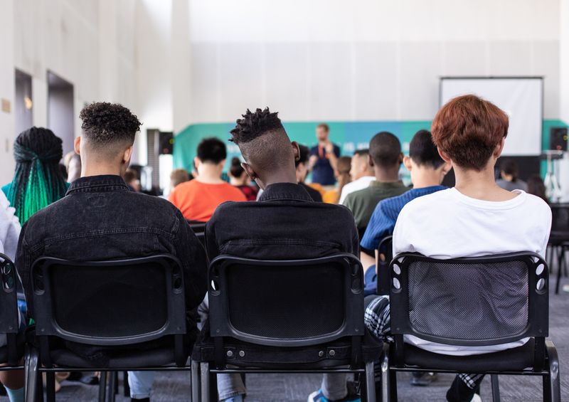 A row of students learning at school. 