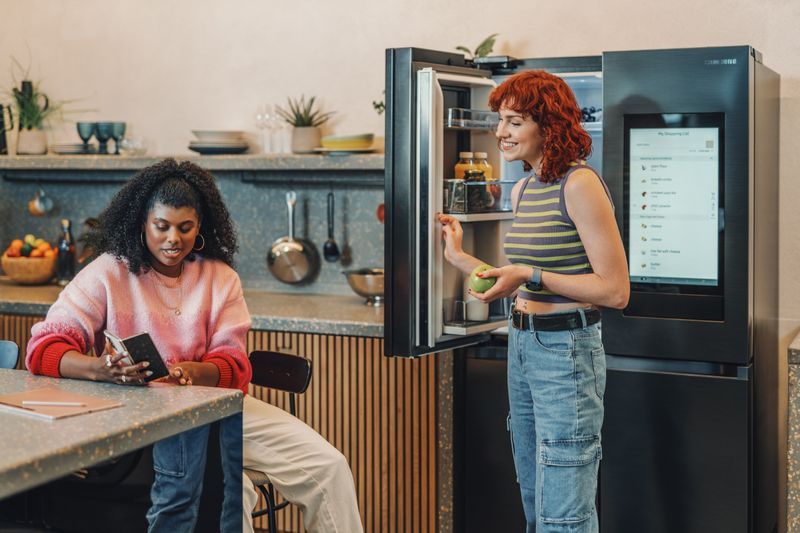 Roommates talking in kitchen 