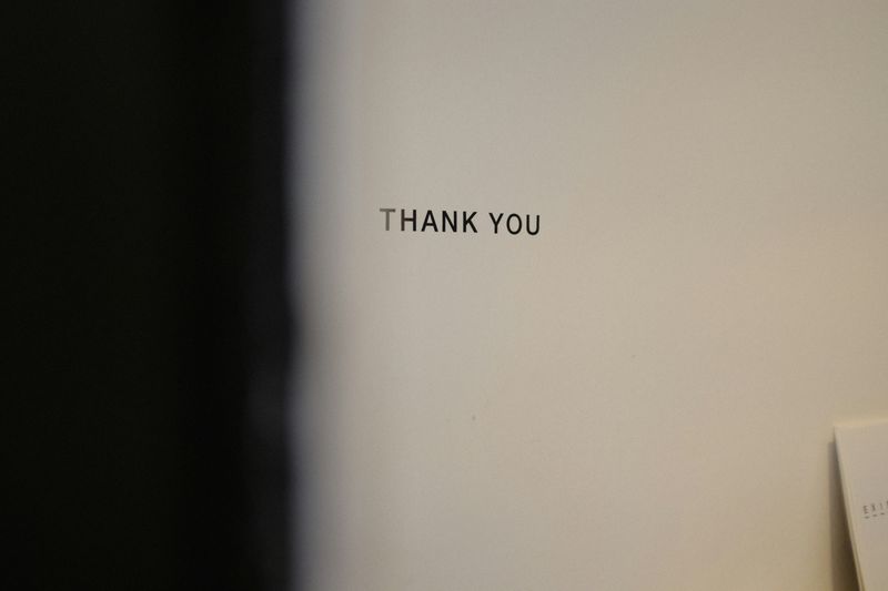 "Thank You" written on a wall.
