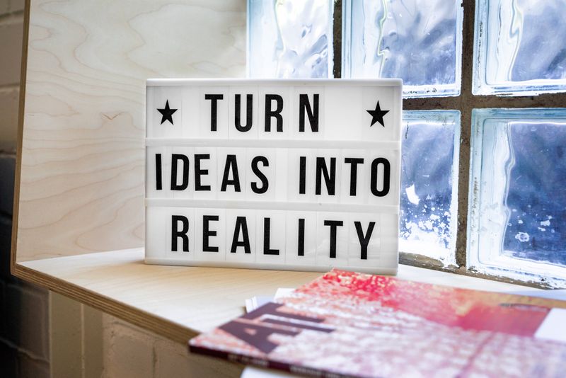 A sign that reads "Ideas turn into reality"
