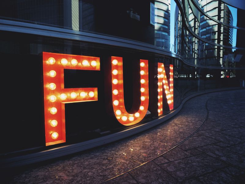 An image with the words 'FUN' as a lit-up sign.