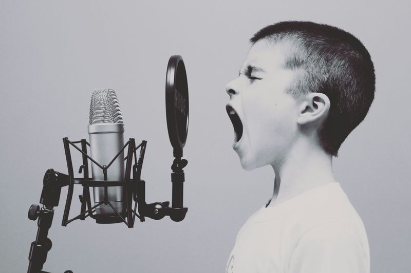 A boy recording a song