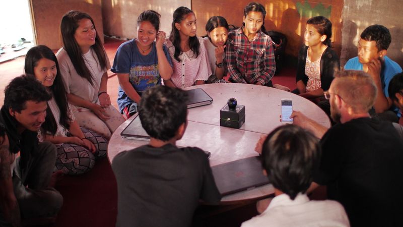 A group of people meeting in a room.