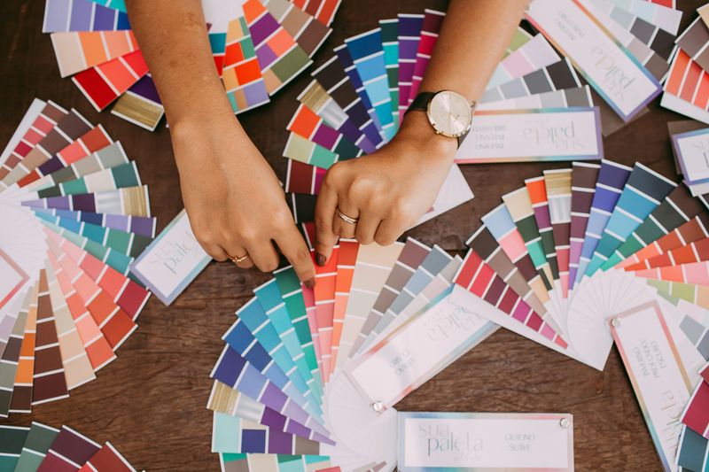 Fingers pointing to color palettes.