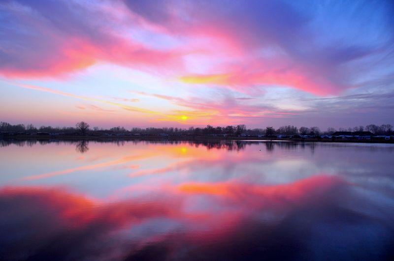 A sunset over a lake.