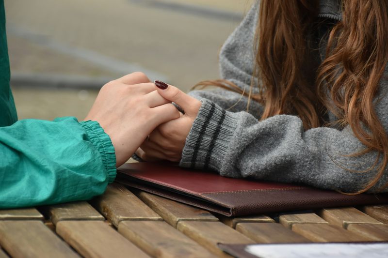 two people holding hands
