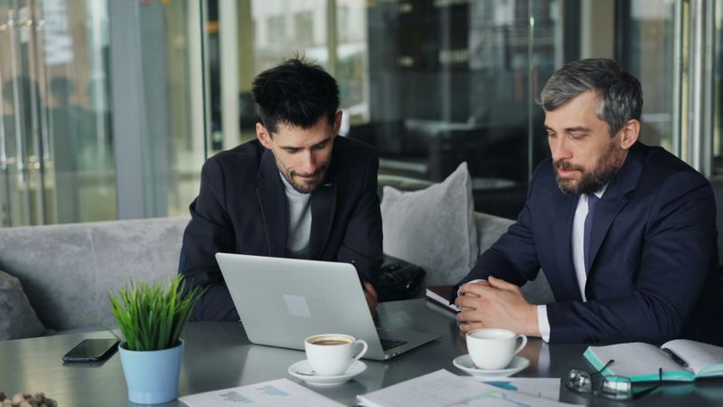 Two men at an office desk