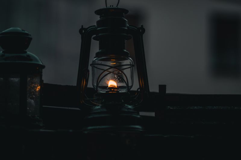 A kerosene lamp in a dark room.