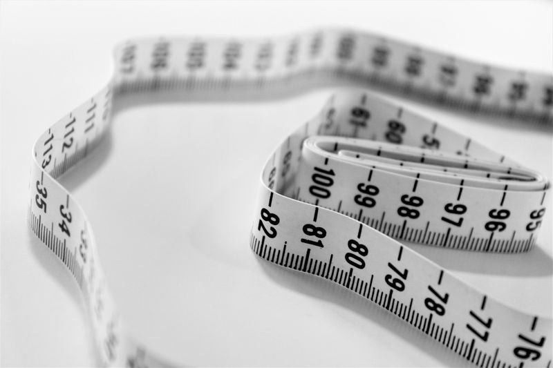 Unspooled measuring tape on a table.