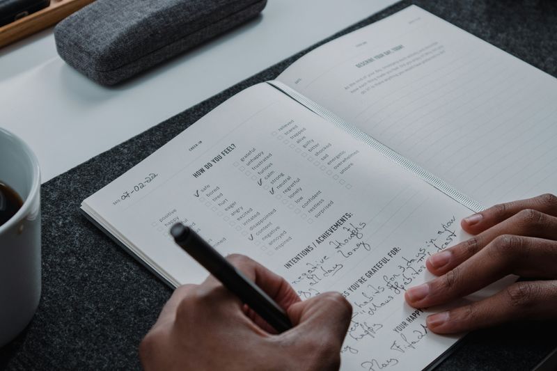 A person writing in a journal.