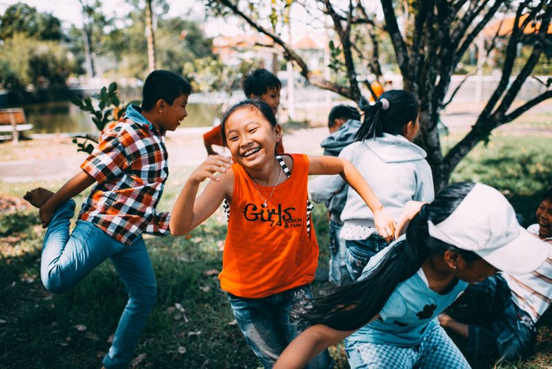 Children playing a game together in a park