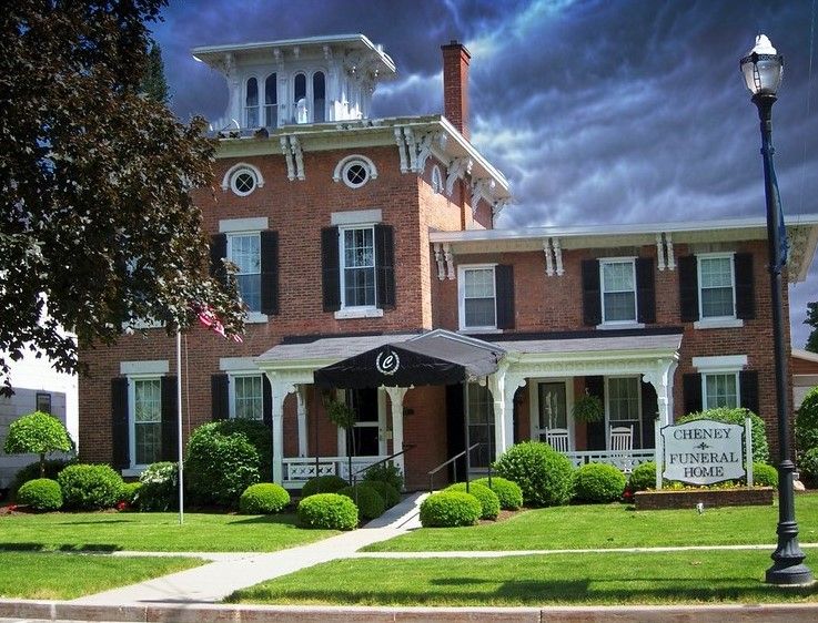 The front entrance of a funeral home, a beautiful old building