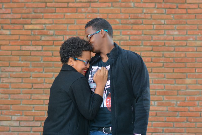 Woman laying on man's chest