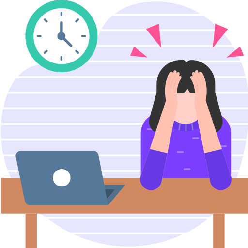 A woman sitting at a desk, looking frustrated with work.