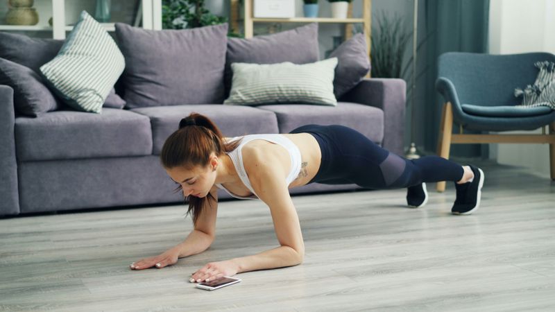 A woman on the floor in a plank position